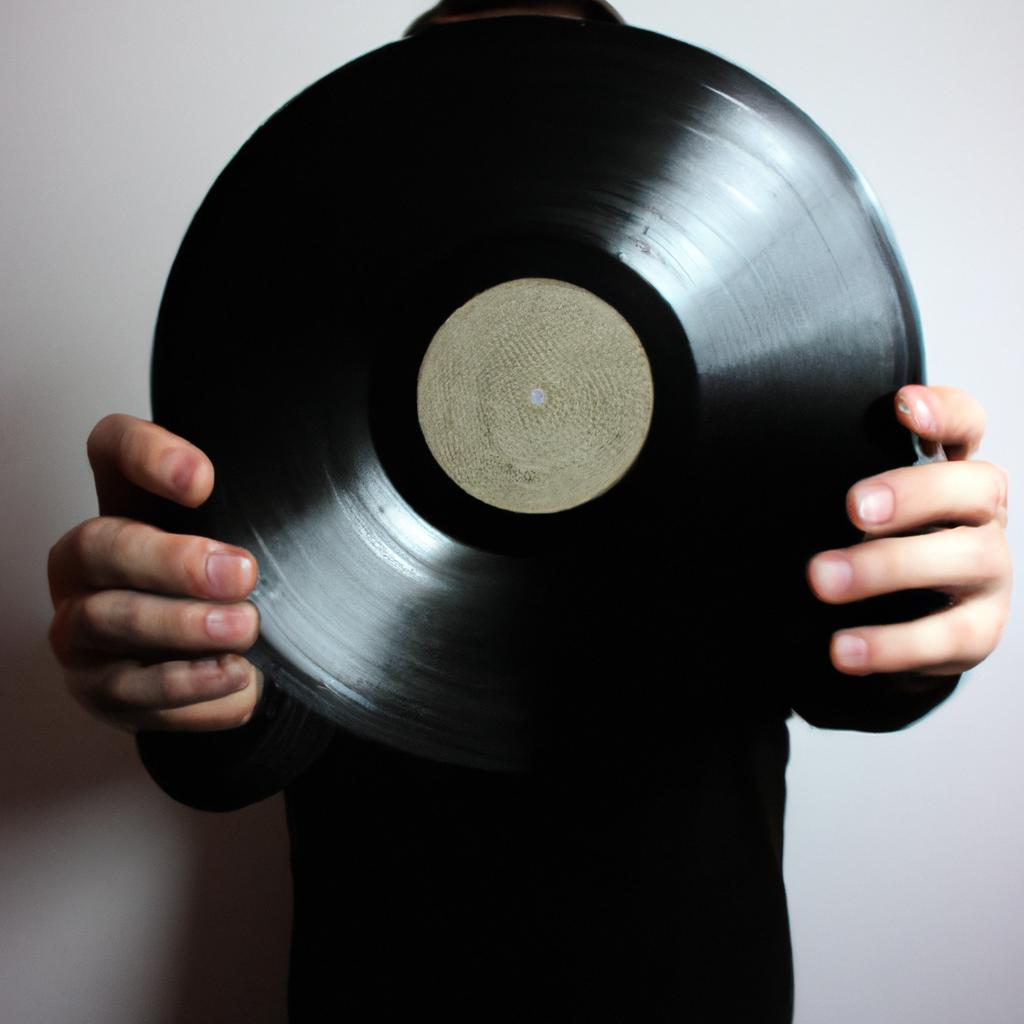 Man holding a vinyl record